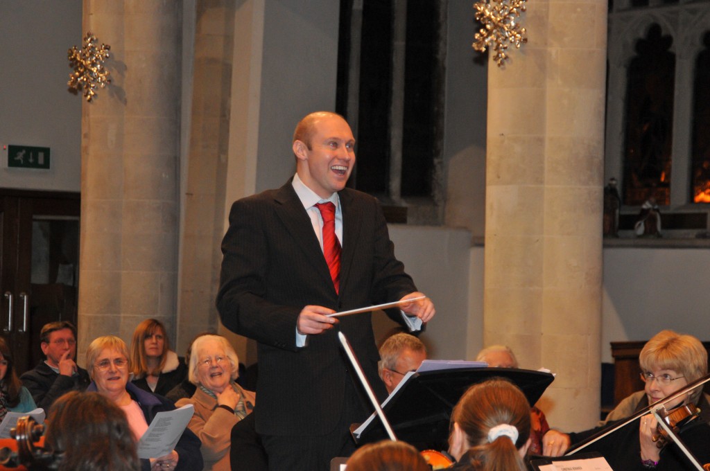 Neil Quigley having a go at conducting the Orchestra